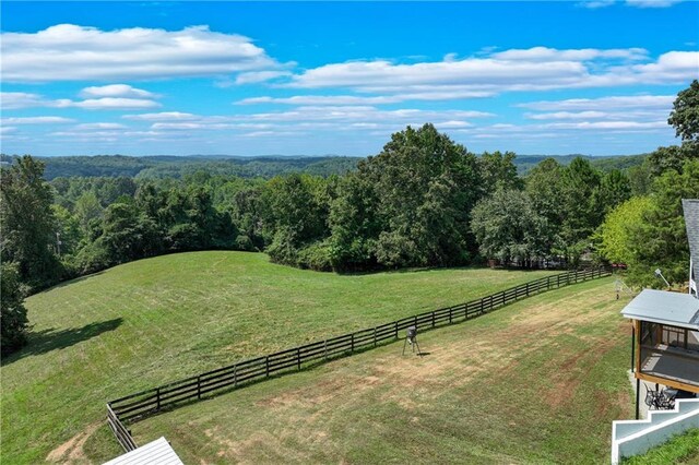 birds eye view of property with a rural view