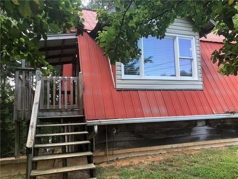 view of side of property with a deck