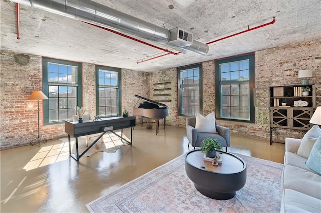 170 Boulevard Se E414, Atlanta, GA 30312 - recreation room with concrete flooring and brick wall