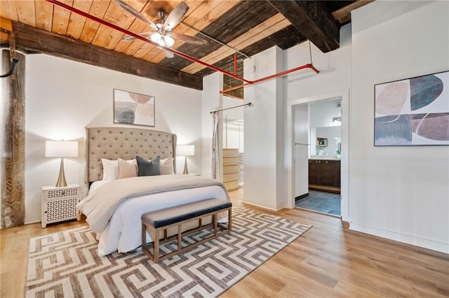170 Boulevard Se E414, Atlanta, GA 30312 - bedroom featuring wood ceiling with exposed beams, wood finished floors, ensuite bath, and baseboards