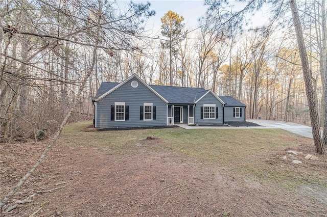 ranch-style home with a front yard