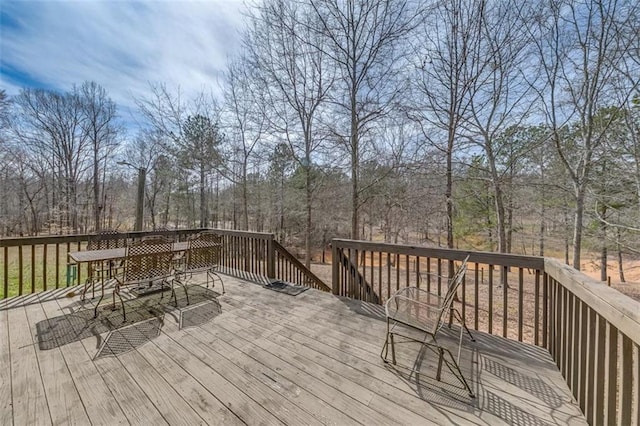 deck with outdoor dining space