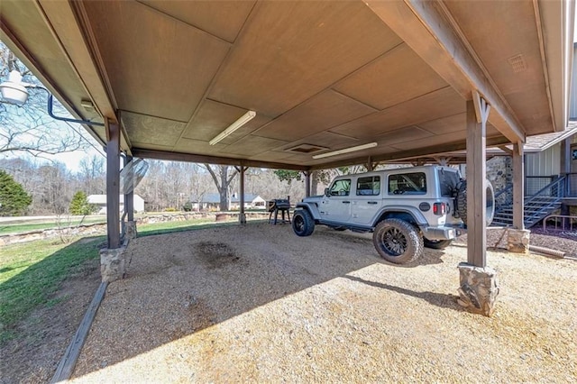 view of parking / parking lot featuring a carport