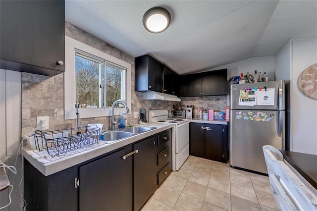 kitchen featuring white electric stove, a sink, light countertops, and freestanding refrigerator