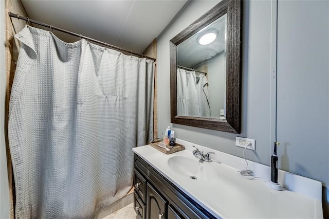 full bath featuring vanity and curtained shower