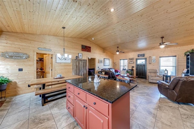 kitchen featuring a kitchen island, open floor plan, lofted ceiling, ceiling fan with notable chandelier, and wooden ceiling