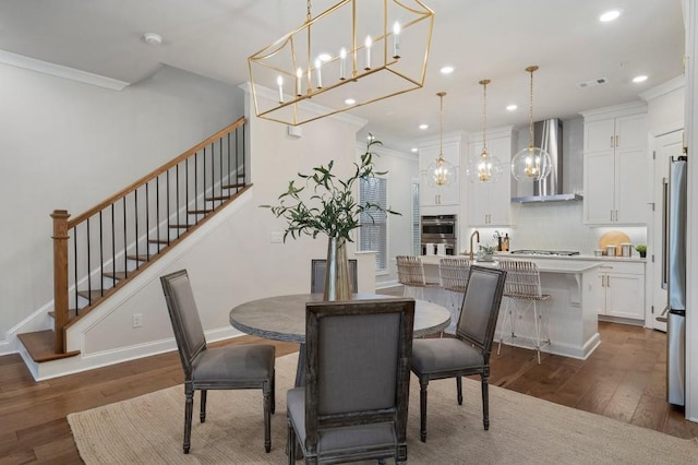 dining area with dark wood-type flooring and ornamental molding