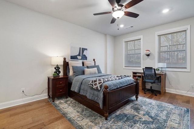 bedroom featuring wood-type flooring and ceiling fan