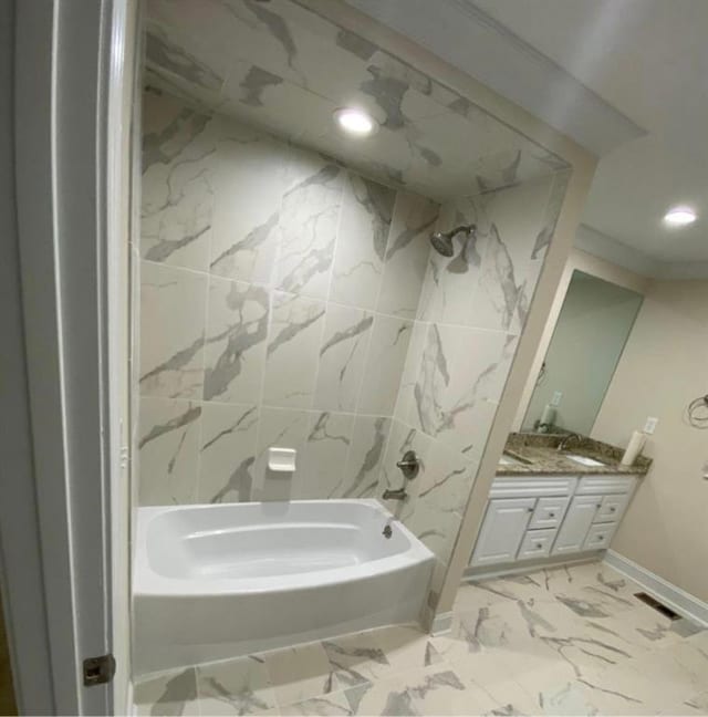 bathroom with vanity and tub / shower combination