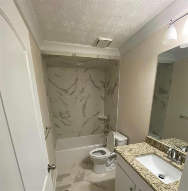 full bathroom featuring vanity, crown molding, tiled shower / bath, toilet, and a textured ceiling