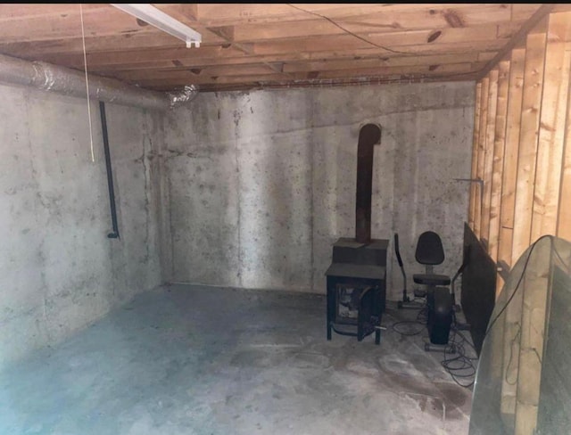 basement featuring a wood stove