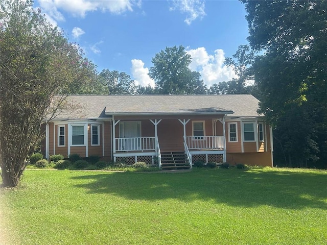 view of front facade with covered porch and a front yard