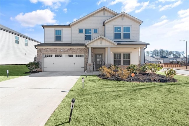 view of front of home featuring a front lawn and a garage