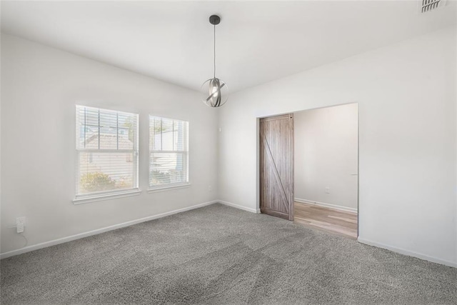 unfurnished room featuring carpet