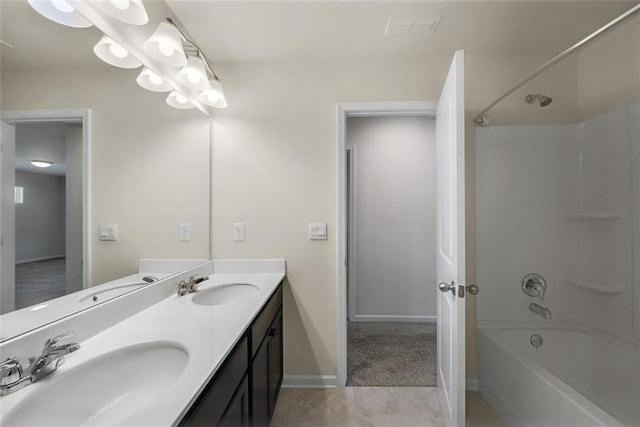 bathroom featuring shower / bathing tub combination, vanity, and tile patterned flooring