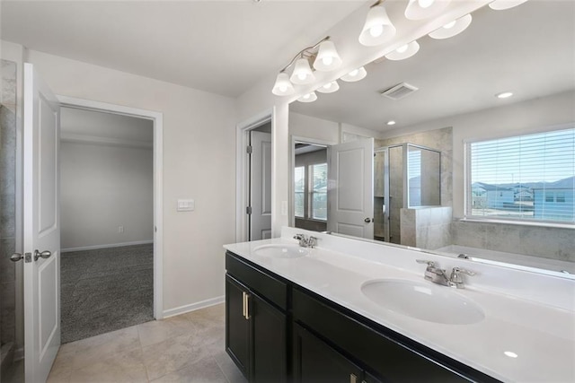 bathroom with vanity, an enclosed shower, and tile patterned flooring