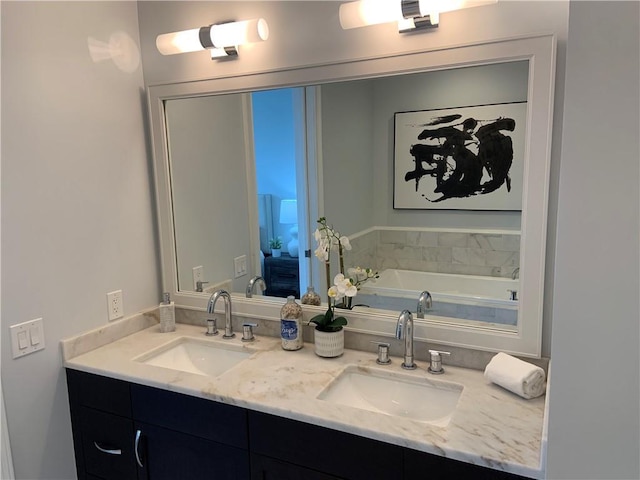 bathroom featuring vanity and a tub