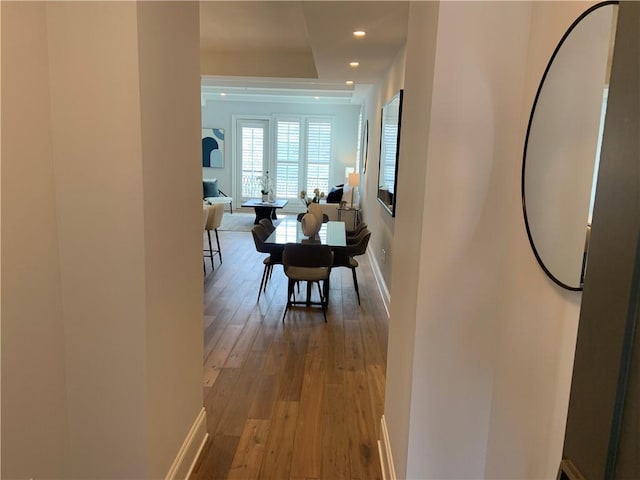 hallway with hardwood / wood-style floors