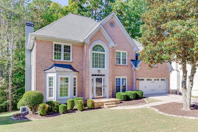 view of front of property with a garage and a front yard