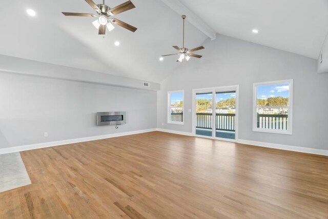 unfurnished living room with high vaulted ceiling, light wood-type flooring, ceiling fan, and beam ceiling