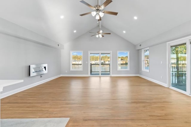 unfurnished living room with high vaulted ceiling, light hardwood / wood-style flooring, and ceiling fan