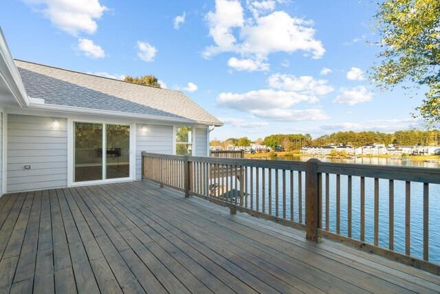 wooden terrace with a water view