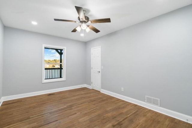 spare room featuring hardwood / wood-style flooring and ceiling fan