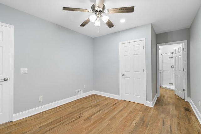 unfurnished bedroom with light hardwood / wood-style floors and ceiling fan