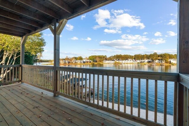 wooden terrace with a water view