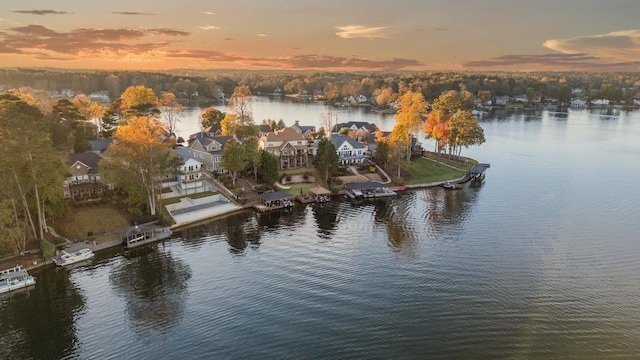 aerial view at dusk with a water view