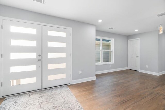 entrance foyer featuring wood-type flooring and french doors