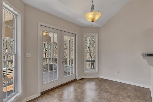 entryway featuring a wealth of natural light, french doors, and baseboards