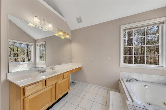 bathroom featuring a garden tub, visible vents, vaulted ceiling, vanity, and tile patterned floors