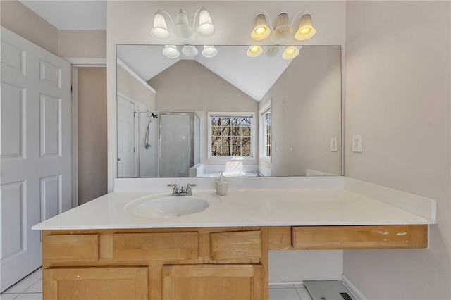 full bath with a stall shower, tile patterned flooring, vaulted ceiling, and vanity