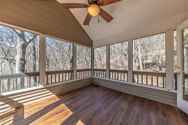 unfurnished sunroom with vaulted ceiling and a ceiling fan