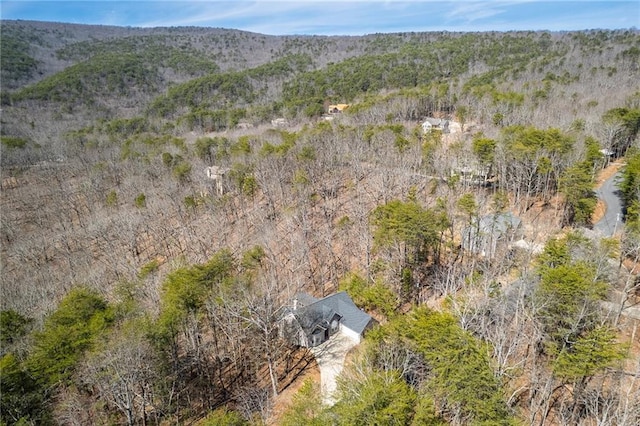 aerial view with a mountain view and a forest view