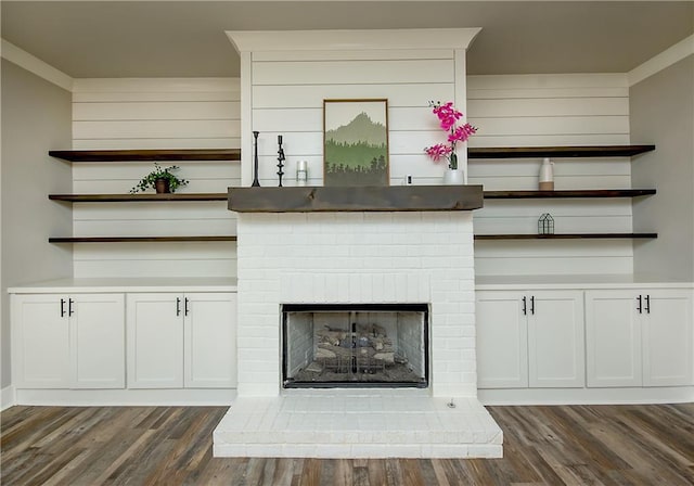 details with a fireplace and wood finished floors