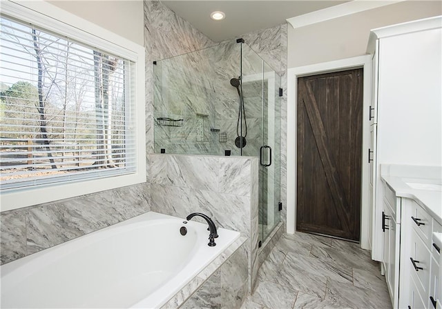 bathroom featuring marble finish floor, vanity, a shower stall, a bath, and recessed lighting