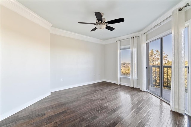 empty room featuring baseboards, dark wood finished floors, a ceiling fan, and ornamental molding