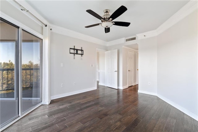 unfurnished room with visible vents, ornamental molding, wood finished floors, baseboards, and ceiling fan