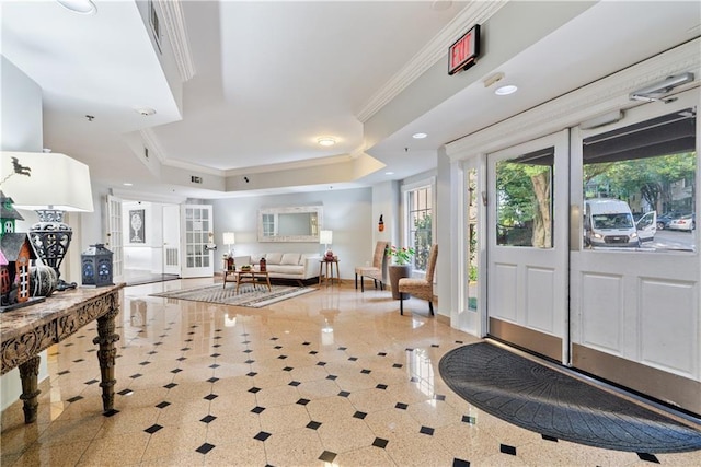 foyer entrance featuring baseboards, a tray ceiling, ornamental molding, recessed lighting, and french doors