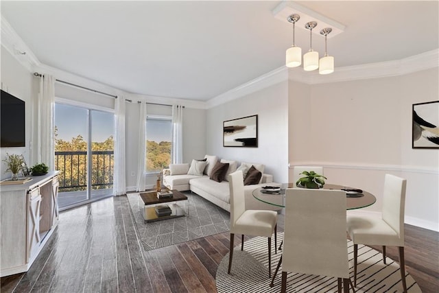 dining room with baseboards, dark wood finished floors, and ornamental molding