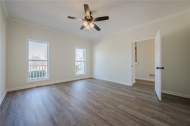 empty room with baseboards, visible vents, and dark wood finished floors