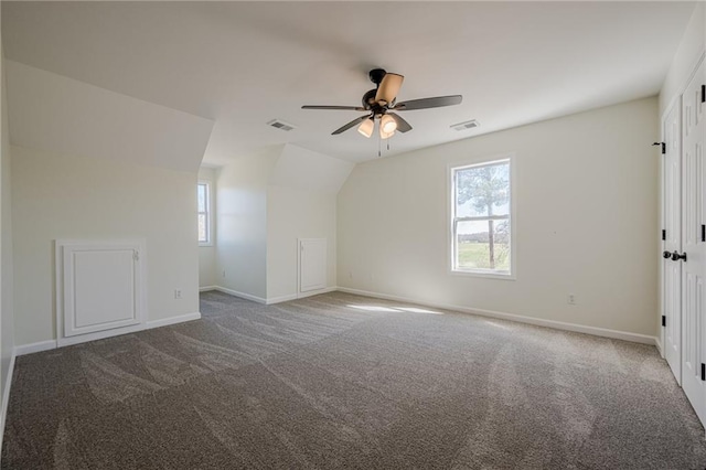 bonus room featuring carpet floors, visible vents, and baseboards