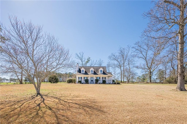 new england style home with a front yard