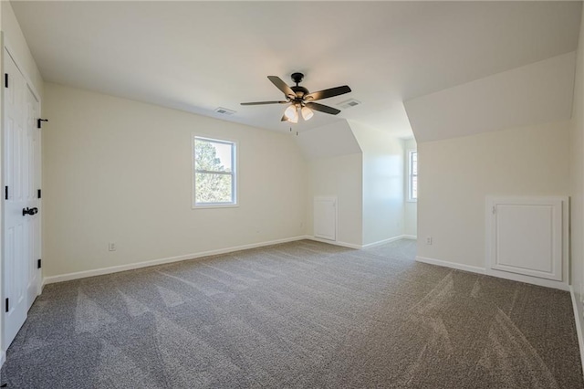 bonus room with carpet floors, a wealth of natural light, and visible vents
