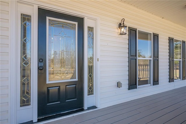 doorway to property featuring covered porch