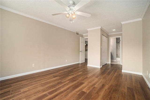 spare room featuring ceiling fan, ornamental molding, dark hardwood / wood-style floors, and a textured ceiling