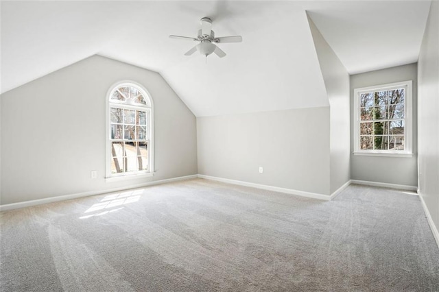 bonus room featuring baseboards, carpet, ceiling fan, and vaulted ceiling