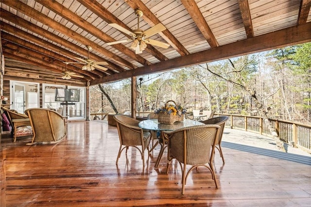 sunroom / solarium featuring wooden ceiling, lofted ceiling with beams, and a ceiling fan